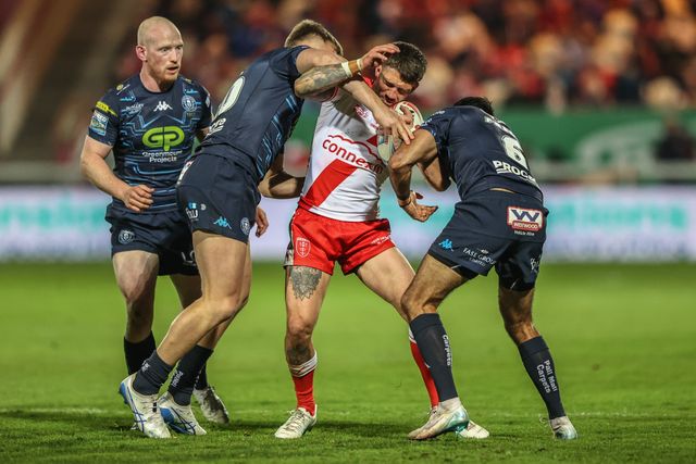 Oliver Gildart of Hull KR is tackled by Harvie Hill of Wigan Warriors and Bevan French of Wigan Warriors during the Betfred Super League Round 7 match Hull KR vs Wigan Warriors at Sewell Group Craven Park, Kingston upon Hull, United Kingdom, 11th April 2025

(Photo by Alfie Cosgrove/News Images)