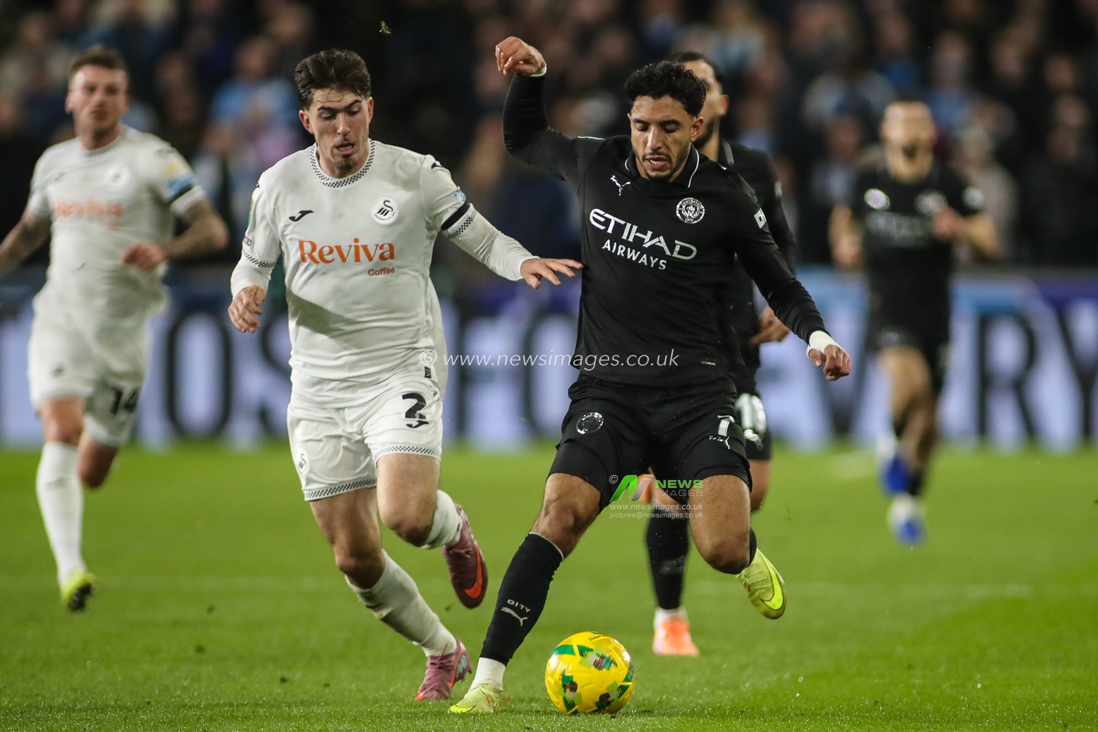 Omar Marmoush of Manchester City and Josh Key of Swansea City compete for the ball during the Carabao Cup Last 16 Swansea City vs Manchester City at Swansea.com Stadium, Swansea, United Kingdom, 29th October 2025

(Photo by Andrew Lewis/News Images)

*** GER AUT SUI OUT ***
