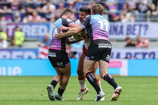 Rhyse Martin of Hull KR is tackled by Cade Cust of Hull F.C. and Joe Batchelor of Hull F.C. during the Betfred Super League Magic Weekend match Hull KR vs Hull FC at Hill Dickinson Stadium, Liverpool, United Kingdom on 04 July 2026

(Photo by Mark Cosgrove/News Images)
