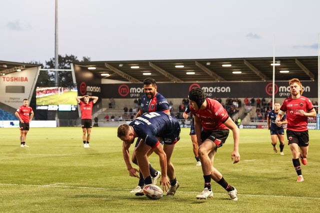 Joe Burgess of Hull KR goes over for his fourth try during the Betfred Super League Round 20 Salford Red Devils vs Hull KR at Salford Community Stadium, Eccles, United Kingdom, 31st July 2025

(Photo by Mark Cosgrove/News Images)