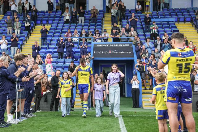 Stefan Ratchford of Warrington Wolves walks out for one last time as players and staff form a guard of honour on his last ever home game as he announces his retirement during the Betfred Super League Round 25 match Warrington Wolves vs Leigh Leopards at Halliwell Jones Stadium, Warrington, United Kingdom, 6th September 2025

(Photo by Mark Cosgrove/News Images)