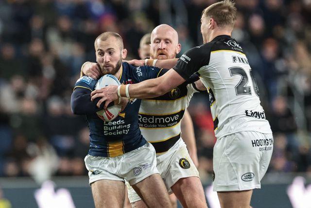 Jarrod O'Connor of Leeds Rhinos is tackled by Jordan Thompson and Oli Field of York Knights during the Betfred Super League Round 2 match Leeds Rhinos vs York Knights at AMT Headingley Stadium, Leeds, United Kingdom on 20 February 2026

(Photo by Mark Cosgrove/News Images)