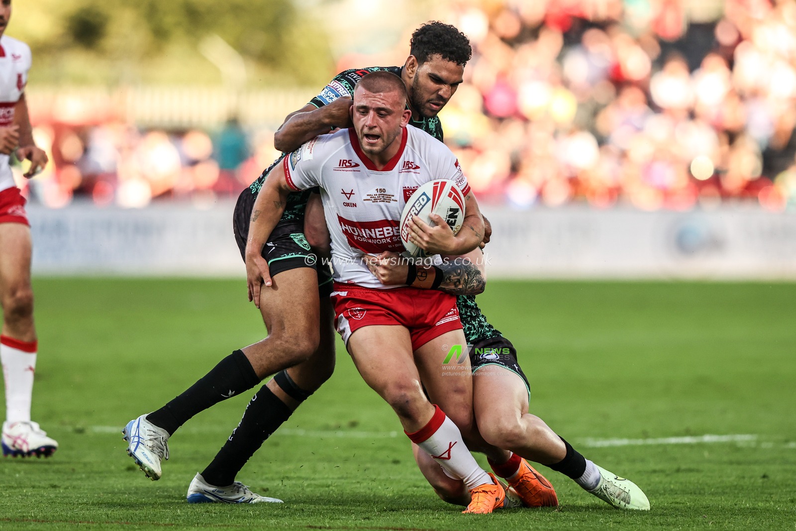 Mikey Lewis of Hull KR is tackled by Jacob Alick-Wiencke of Leigh Leopards and Adam Cook of Leigh Leopards during the Betfred Super League round 15 match Hull KR vs Leigh Leopards at Sewell Group Craven Park, Hull, United Kingdom on 19 June 2026

(Photo by Alfie Cosgrove/News Images)