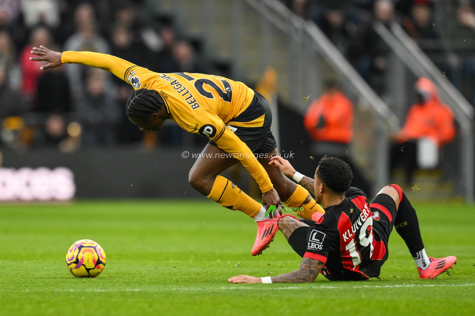 Jean-Ricner Bellegarde of Wolverhampton Wanderers rides the tackle of Justin Kluivert of Bournemouth during the Premier League match Wolverhampton Wanderers vs Bournemouth at Molineux, Wolverhampton, United Kingdom, 30th November 2024

(Photo by Craig Thomas/News Images)