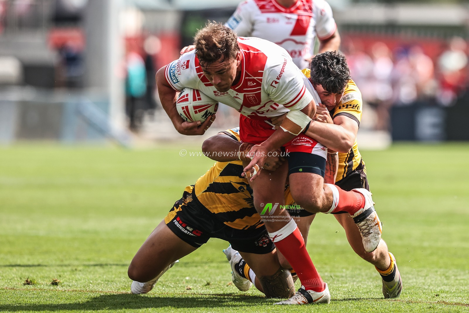 Jai Whitbread of Hull KR is tackled during the Betfred Super League round 21 match Hull KR vs Castleford Tigers at Sewell Group Craven Park, Kingston upon Hull, United Kingdom, 9th August 2025

(Photo by Alfie Cosgrove/News Images)