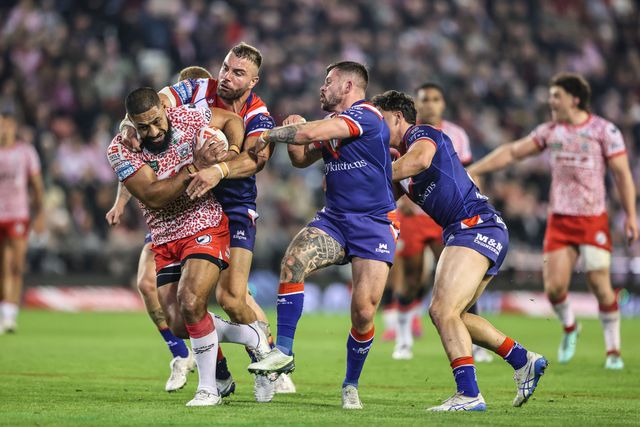 Isaac Liu of Leigh Leopards is tackled during the Betfred Super League play-off Eliminator 1 match Leigh Leopards vs Wakefield Trinity at Progress With Unity Stadium, Leigh, United Kingdom, 26th September 2025

(Photo by Alfie Cosgrove/News Images)