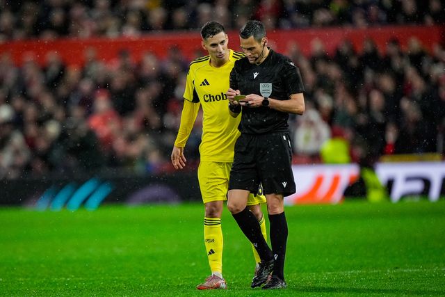 Referee Maurizio Mariani gives a yellow card to  Lorenzo Lucca of Nottingham Forest during the UEFA Europa League 
Knockout Round Play-offs match Nottingham Forest vs Fenerbahce at City Ground, Nottingham, United Kingdom on 26 February 2026

(Photo by Maynard Manyowa/News Images)