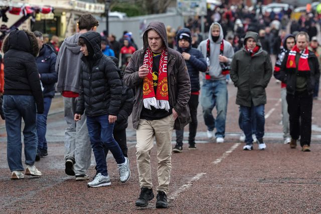 Manchester United fans make their way to Old Trafford during the Premier League match Manchester United vs Aston Villa at Old Trafford, Manchester, United Kingdom on 15 March 2026

(Photo by Mark Cosgrove/News Images)