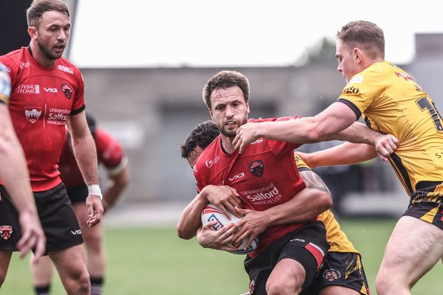 Joe Mellor of Salford Red Devils is tackled during the Betfred Super League Round 18 match Salford Red Devils vs Castleford Tigers at Salford Community Stadium, Eccles, United Kingdom, 13th July 2025

(Photo by Alfie Cosgrove/News Images)