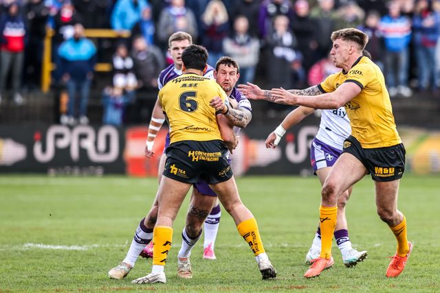 Jay Pitts of Wakefield Trinity is tackled by Daejarn Asi of Castleford Tigers during the Betfred Super League round 7 match Castleford Tigers vs Wakefield Trinity at OneBore Stadium, Castleford, Untied Kingdom on 05 April 2026

(Photo by Alfie Cosgrove/News Images)