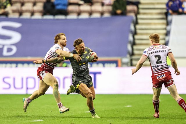 Chris Hankinson of Leeds Rhinos and Adam Keighran of Wigan Warriors battle for the ball during the Betfred Super League round 11 match Wigan Warriors vs Leeds Rhinos at The Brick Community Stadium, Wigan, United Kingdom on 15 May 2026

(Photo by Alfie Cosgrove/News Images)