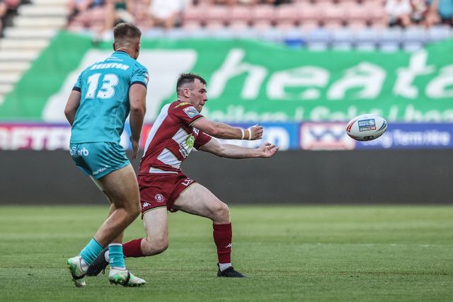 Harry Smith of Wigan Warriors passes the ball during the Betfred Super League round 18 match Wigan Warriors vs Huddersfield Giants at The Brick Community Stadium, Wigan, United Kingdom, 11th July 2025

(Photo by Alfie Cosgrove/News Images)