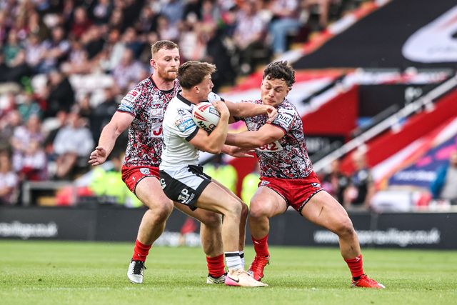 Logan Moy of Hull FC is tackled by Lachlan Lam of Leigh Leopards during the Betfred Super League round 12 match Leigh Leopards vs Hull FC at Leigh Sports Village, Leigh, United Kingdom on 22 May 2026

(Photo by Alfie Cosgrove/News Images)