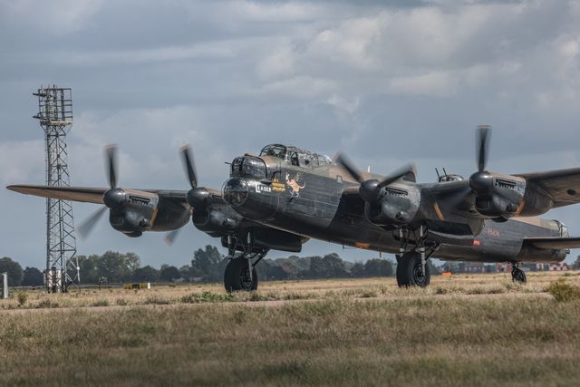 Battle of Britain Memorial Flight Avro Lancaster heavy bomber lands at RAF Coningsby