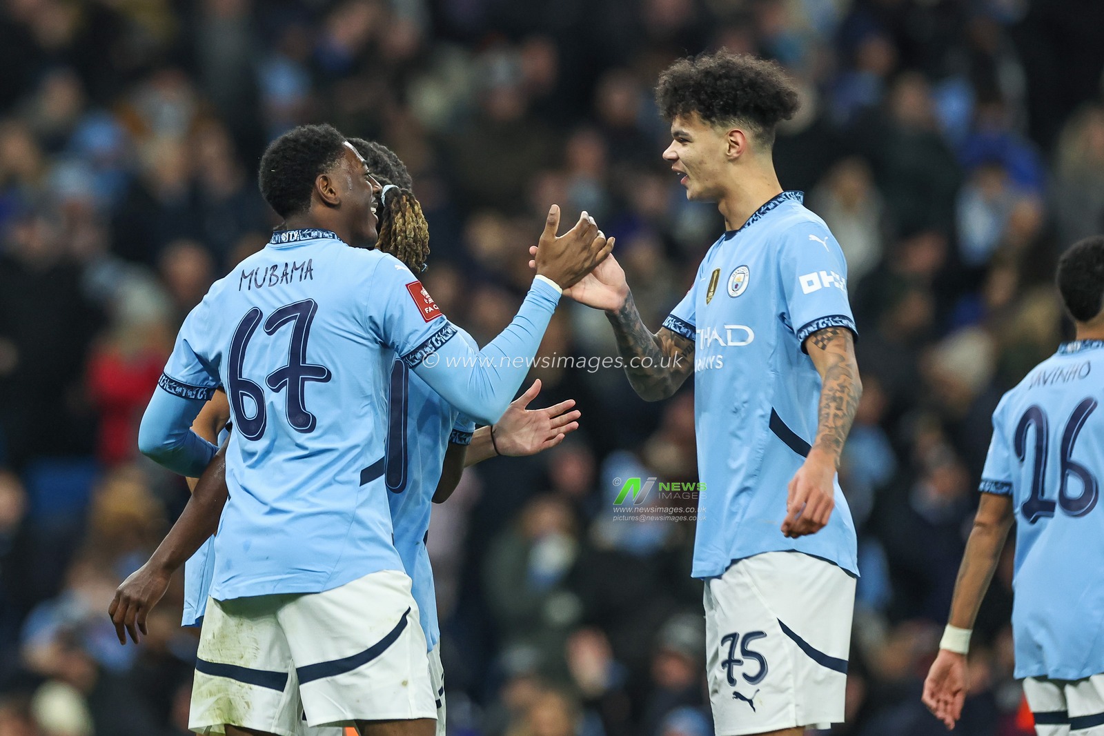 Divin Mubama of Manchester City celebrates his goal to make it 2-0 during the Emirates FA Cup 3rd Round match Manchester City vs Salford City at Etihad Stadium, Manchester, United Kingdom, 11th January 2025

(Photo by Mark Cosgrove/News Images)