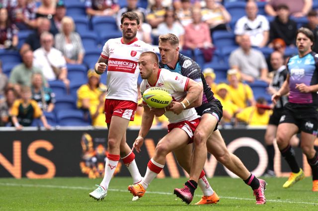 Mikey Lewis of Hull KR is tackled by Jed Cartwright of Hull FC during the Betfred Super League Magic Weekend match Hull KR vs Hull FC at Hill Dickinson Stadium, Liverpool, United Kingdom on 04 July 2026

(Photo by Alfie Cosgrove/News Images)