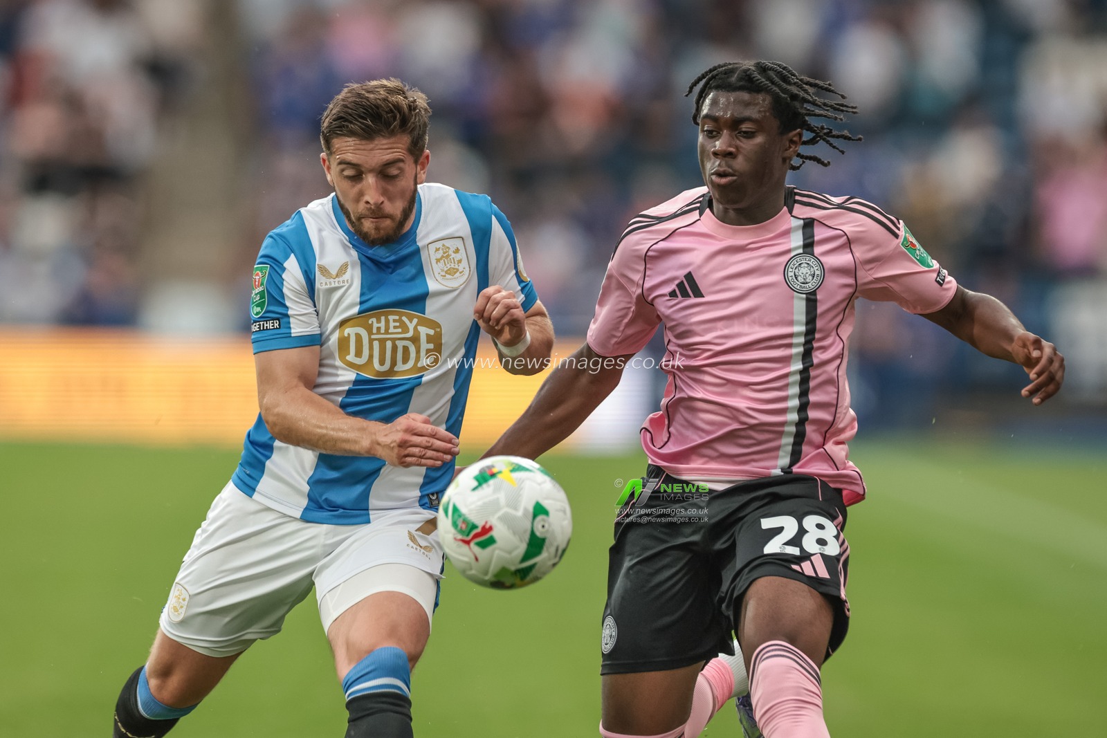 Jeremy Monga of Leicester City  and Lynden Gooch of Huddersfield Town battle for the ball during the Carabao Cup match Huddersfield Town vs Leicester City at Accu Stadium, Huddersfield, United Kingdom, 13th August 2025

(Photo by Mark Cosgrove/News Images)