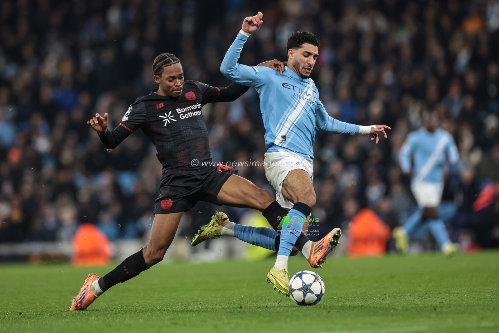 Omar Marmoush of Manchester City is tackled by Jeanuël Belocian of Bayer 04 Leverkusen during the UEFA Champions League Matchday 5 of 8 Manchester City v Bayer 04 Leverkusen at City of Manchester Stadium, Manchester, United Kingdom, 25th November 2025

(Photo by Mark Cosgrove/News Images)

*** GER AUT SUI OUT ***