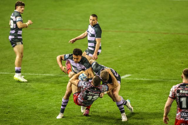 Innes Senior of Leigh Leopards is tackled by Asher O'Donnell of Huddersfield Giants during the Betfred Super League round 9 match Leigh Leopards vs Huddersfield Giants at Leigh Sports Village, Leigh, United Kingdom on 23 April 2026

(Photo by Alfie Cosgrove/News Images)