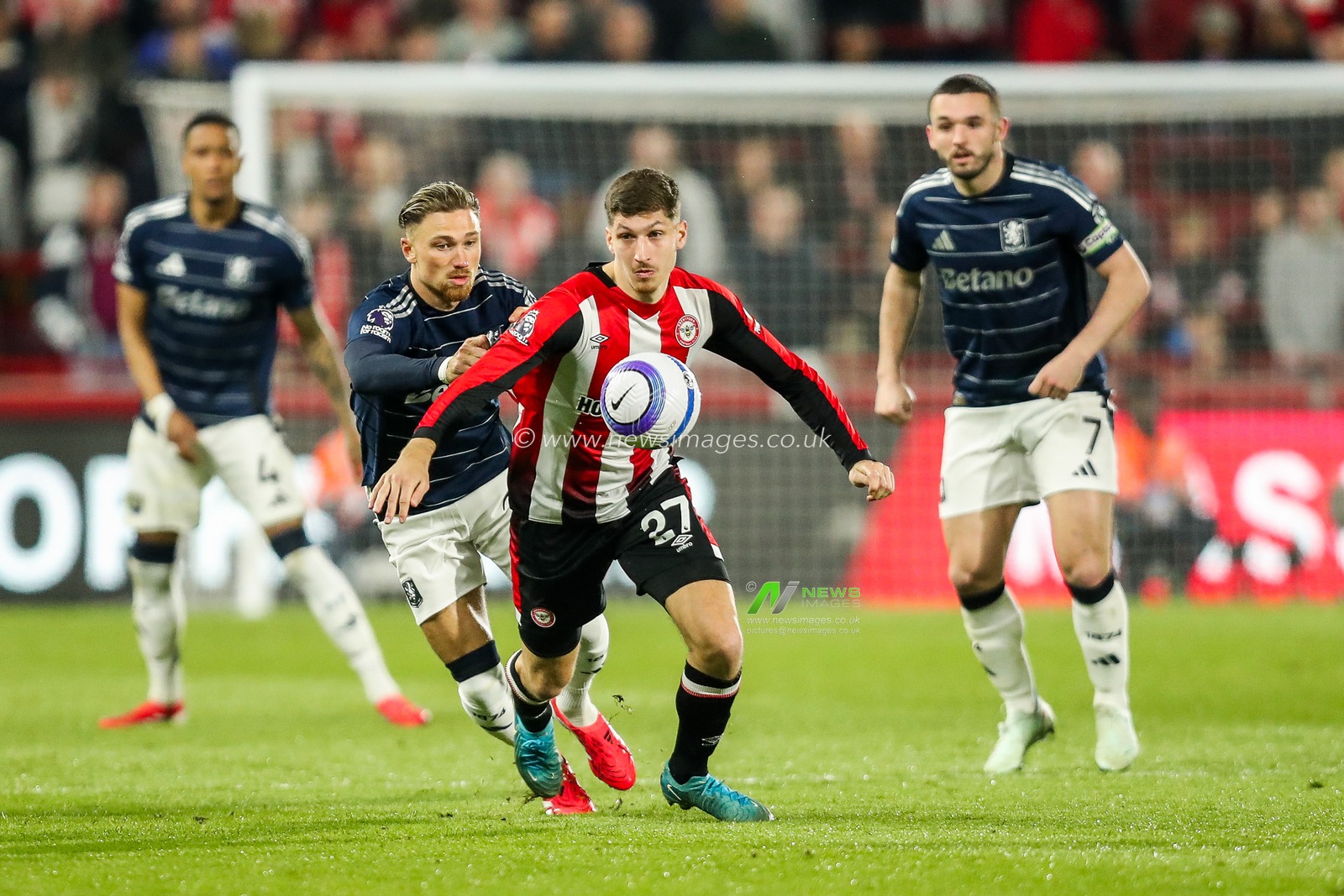 Vitaly Janelt of Brentford is put under pressure by Matty Cash of Aston Villa during the Premier League match Brentford vs Aston Villa at The Gtech Community Stadium, London, United Kingdom, 8th March 2025

(Photo by Izzy Poles/News Images)