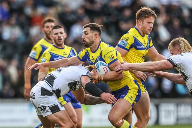 Ryan Matterson of Warrington Wolves is tackled during the Betfred Super League Round 26 match Hull FC vs Warrington Wolves at MKM Stadium, Hull, United Kingdom, 13th September 2025

(Photo by Alfie Cosgrove/News Images)