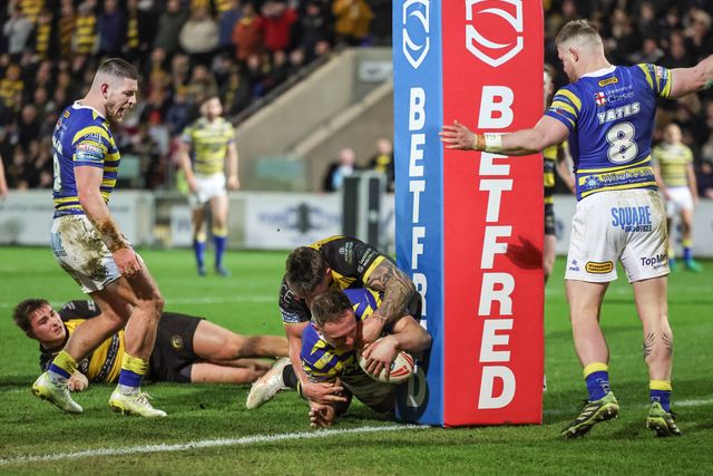 Ben Currie goes over for his 100th Warrington Wolves try during the Betfred Super League Round 4 match York Knights vs Warrington Wolves at LNER Community Stadium, York, United Kingdom on 06 March 2026

(Photo by Mark Cosgrove/News Images)