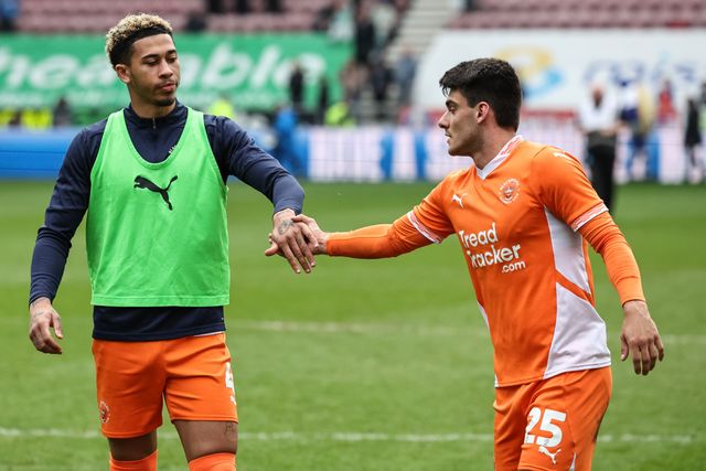 Jordan Lawrence-Gabriel of Blackpool and Rob Apter of Blackpool shake hands during the Sky Bet League 1 match Wigan Athletic vs Blackpool at The Brick Community Stadium, Wigan, United Kingdom, 26th April 2025

(Photo by Mark Cosgrove/News Images)