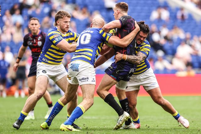 Frankie Halton of Leigh Leopards is tackled by James Harrison of Warrington Wolves and Luke Thomas of Warrington Wolves during the Betfred Super League Magic Weekend match Leigh Leopards vs Warrington Wolves at Leigh Sports Village, Leigh, United Kingdom on 04 July 2026

(Photo by Alfie Cosgrove/News Images)