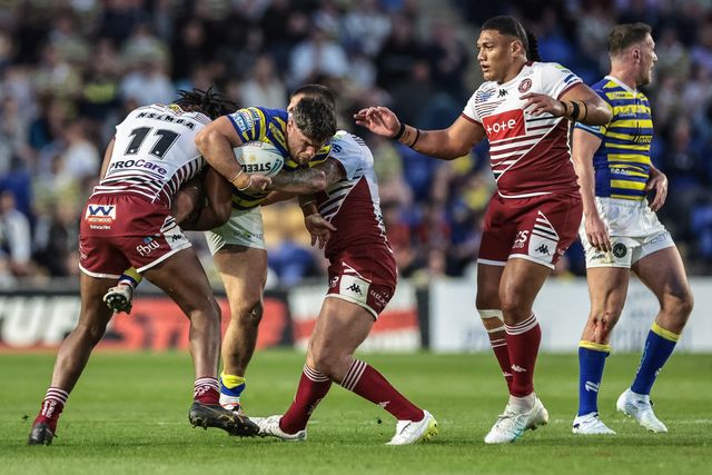 Toafofoa Sipley of Warrington Wolves is tackled by Junior Nsemba of Wigan Warriors during the Betfred Super League round 9 match Warrington Wolves vs Wigan Warriors at The Halliwell Jones Stadium, Warrington, United Kingdom on 24 April 2026

(Photo by Mark Cosgrove/News Images)