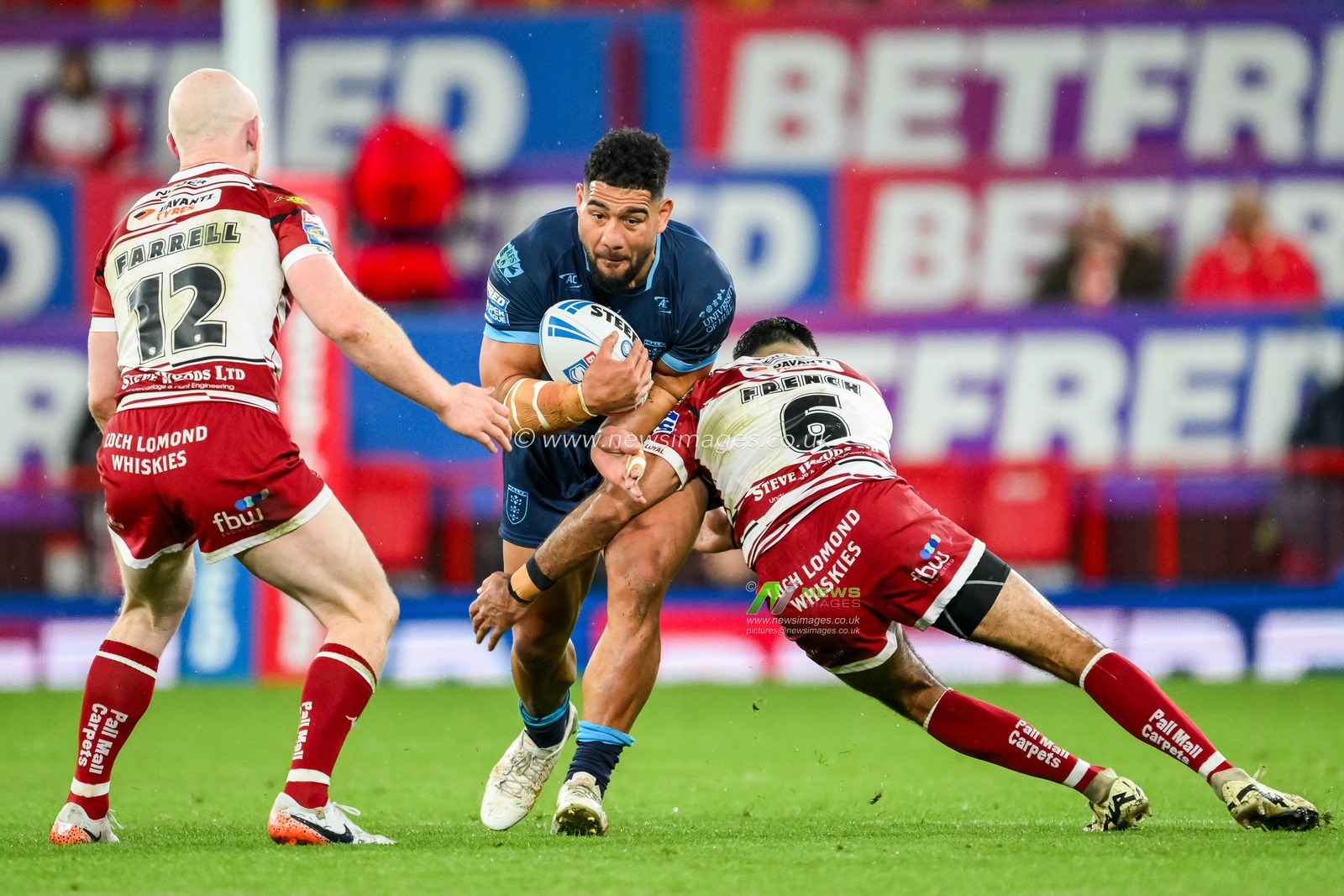 Kelepi Tanginoa of Hull KR is tackled by Bevan French of Wigan Warriors during the Betfred Super League Grand Final match Wigan Warriors vs Hull KR at Old Trafford, Manchester, United Kingdom, 12th October 2024

(Photo by Craig Thomas/News Images)