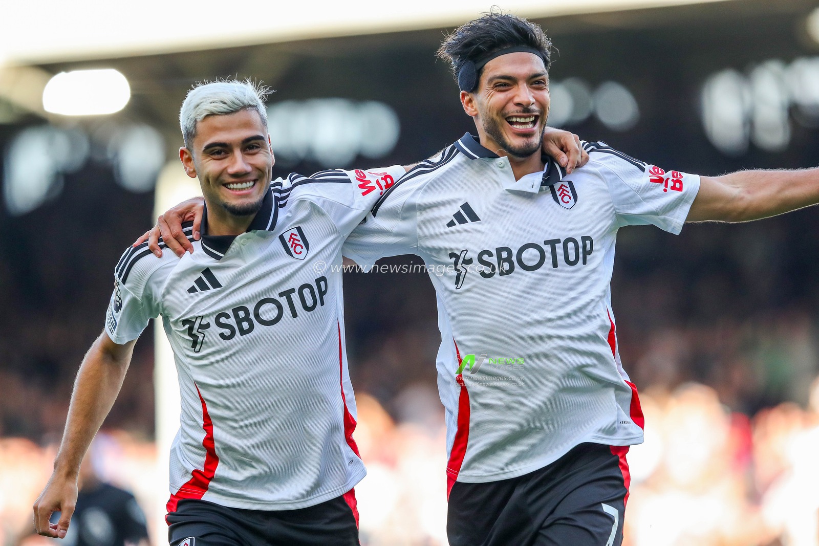 Raul Jimenez of Fulham celebrates his goal with Andreas Pereira to make 1-0 during the Premier League match Fulham vs Aston Villa at Craven Cottage, London, United Kingdom, 19th October 2024

(Photo by Izzy Poles/News Images)