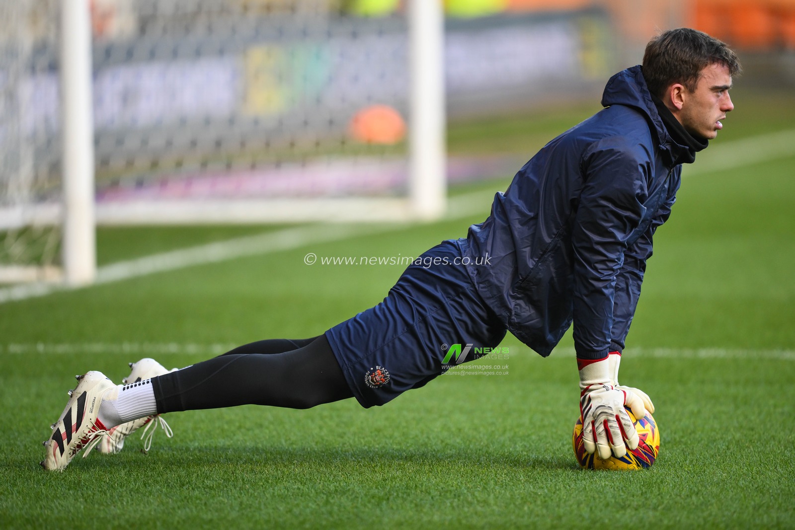 Harry Tyrer of Blackpool stretches during the pre-game warmup ahead of the Sky Bet League 1 match Blackpool vs Shrewsbury Town at Bloomfield Road, Blackpool, United Kingdom, 1st January 2025

(Photo by Craig Thomas/News Images)