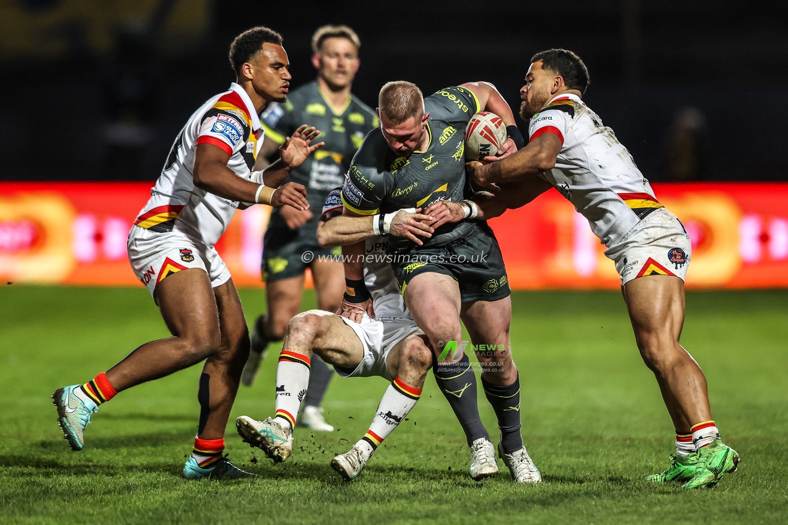 Tom Holroyd of Leeds Rhinos is tackled by Chris Atkin of Bradford Bulls and Esan Marsters of Bradford Bulls during the Betfred Super League round 7 match Bradford Bulls vs Leeds Rhinos at Odsal Stadium, Bradford, United Kingdom on 03 April 2026

(Photo by Alfie Cosgrove/News Images)