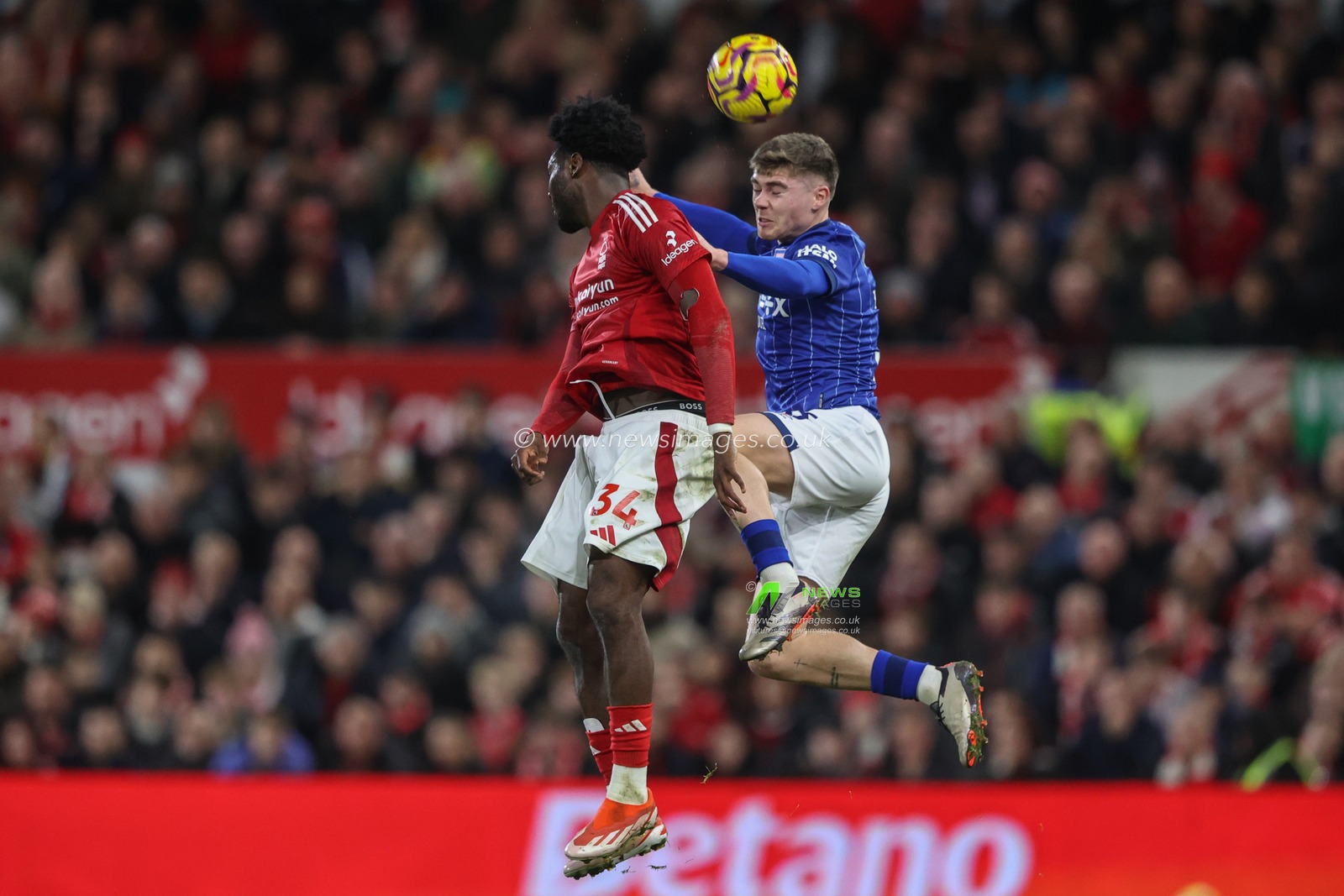 Leif Davis of Ipswich Town jumps up to win the high ball from Ola Aina of Nottingham Forest during the Premier League match Nottingham Forest vs Ipswich Town at City Ground, Nottingham, United Kingdom, 30th November 2024

(Photo by Alfie Cosgrove/News Images)
