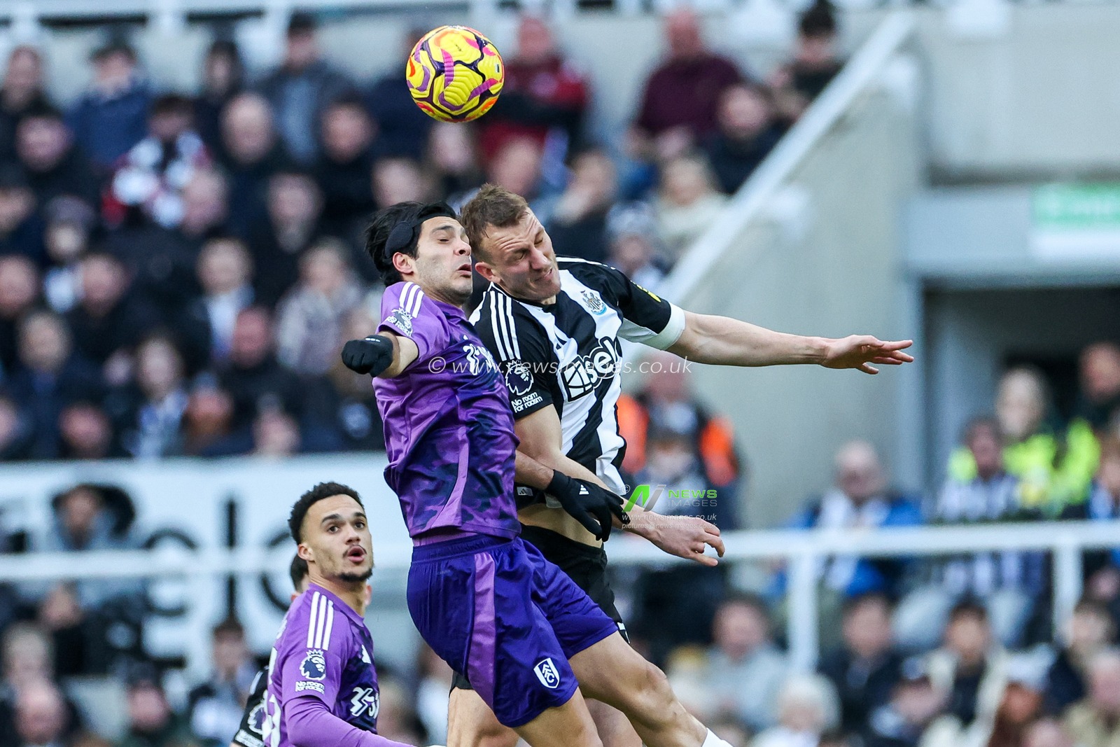 Raul Jimenez of Fulham jumps for the ball with Dan Burn of Newcastle United during the Premier League match Newcastle United vs Fulham at St. James's Park, Newcastle, United Kingdom, 1st February 2025

(Photo by Mark Cosgrove/News Images)
