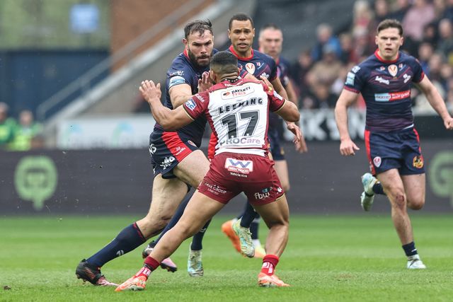 Alex Walmsley of St. Helens hands-off ï»¿ï»¿ï»¿Kruise Leeming of Wigan Warriors during the Betfred Super League Round 8 match Wigan Warriors vs St Helens at The Brick Community Stadium, Wigan, United Kingdom, 18th April 2025

(Photo by Mark Cosgrove/News Images)