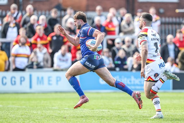 Josh Rourke of Wakefield Trinity breaks with the ball to go over for a try during the Betfred Super League round 8 match Wakefield Trinity vs Bradford Bulls at DIY Kitchens Stadium, Wakefield, United Kingdom on 18 April 2026

(Photo by Alfie Cosgrove/News Images)