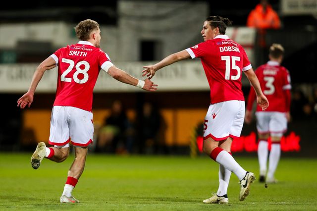 Sam Smith of Wrexham AFC celebrates his goal with George Dobson to make it 2-2 during the Sky Bet League 1 match Cambridge United vs Wrexham at Abbey Stadium, Cambridge, United Kingdom, 1st April 2025

(Photo by Izzy Poles/News Images)