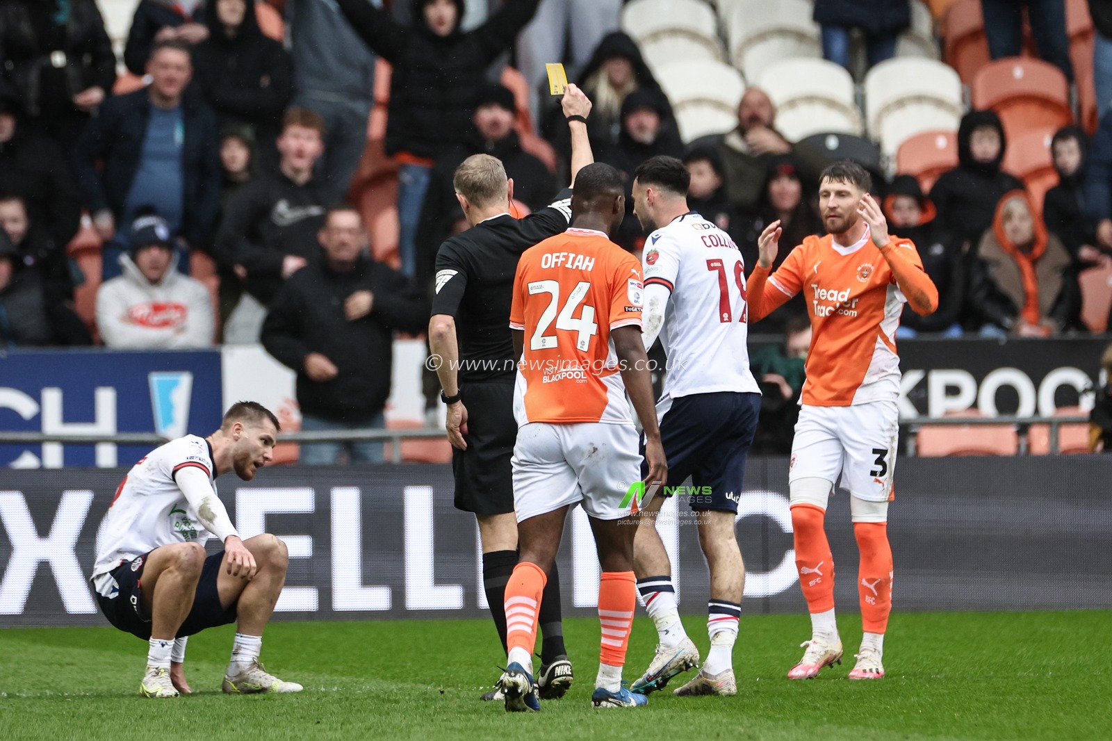 Referee Graham Scott gives a yellow card to James Husband of Blackpool during the Sky Bet League 1 match Blackpool vs Bolton Wanderers at Bloomfield Road, Blackpool, United Kingdom, 29th March 2025

(Photo by Mark Cosgrove/News Images)