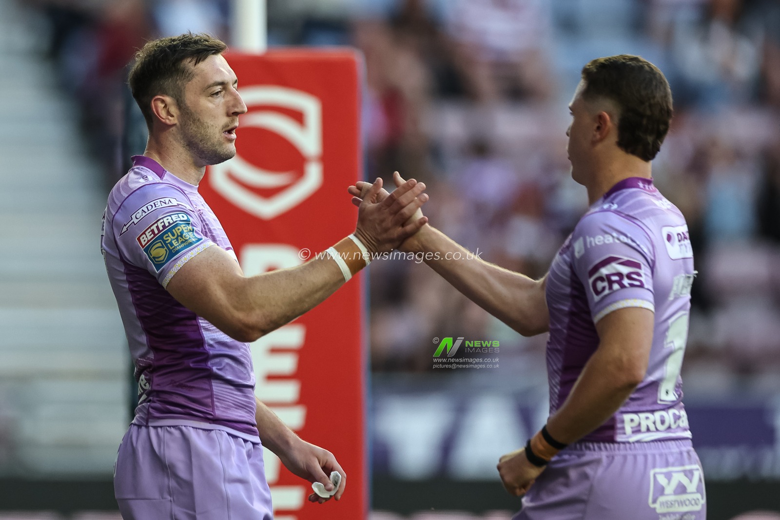 Jake Wardle of Wigan Warriors celebrates his try with Jai Field of Wigan Warriors during the Betfred Super League Round 11 match Wigan Warriors vs Leigh Leopards at The Brick Community Stadium, Wigan, United Kingdom, 16th May 2025

(Photo by Mark Cosgrove/News Images)