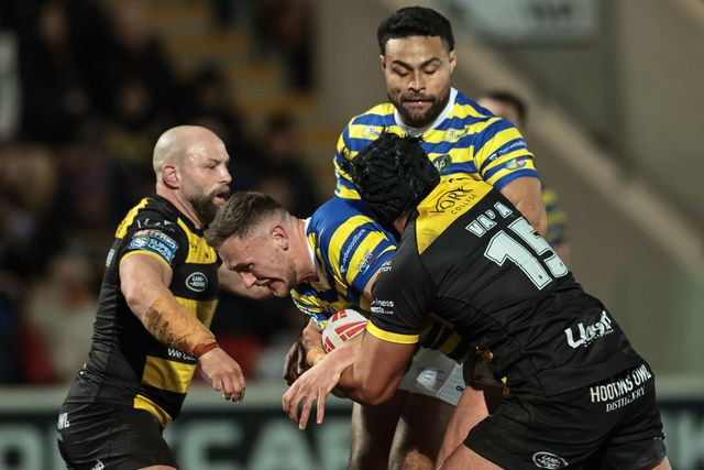 Ben Currie of Warrington Wolves is tackled by Xavier Va’a of York Knights during the Betfred Super League Round 4 match York Knights vs Warrington Wolves at LNER Community Stadium, York, United Kingdom on 06 March 2026

(Photo by Mark Cosgrove/News Images)
