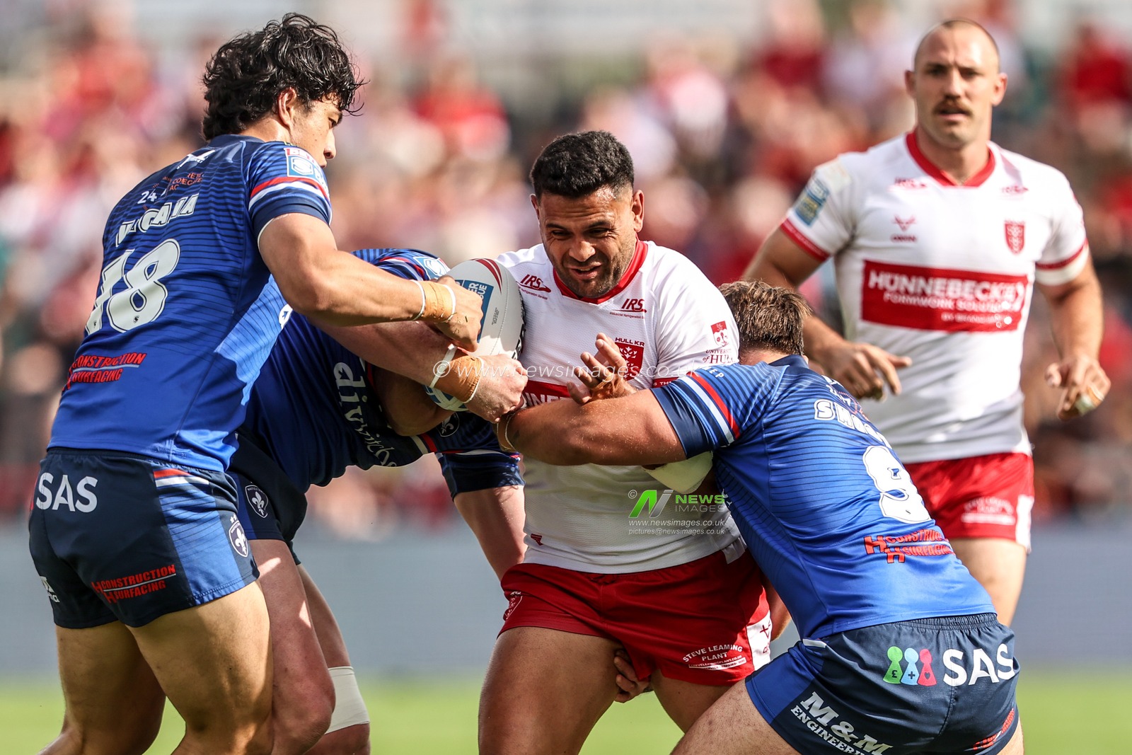 Rhyse Martin of Hull KR is tackled by Tyson Smoothy of Wakefield Trinity and Isaiah Vagana of Wakefield Trinity during the Betfred Super League round 18 match Hull KR vs Wakefield Trinity at Sewell Group Craven Park, Hull, United Kingdom on 11 July 2026

(Photo by Alfie Cosgrove/News Images)