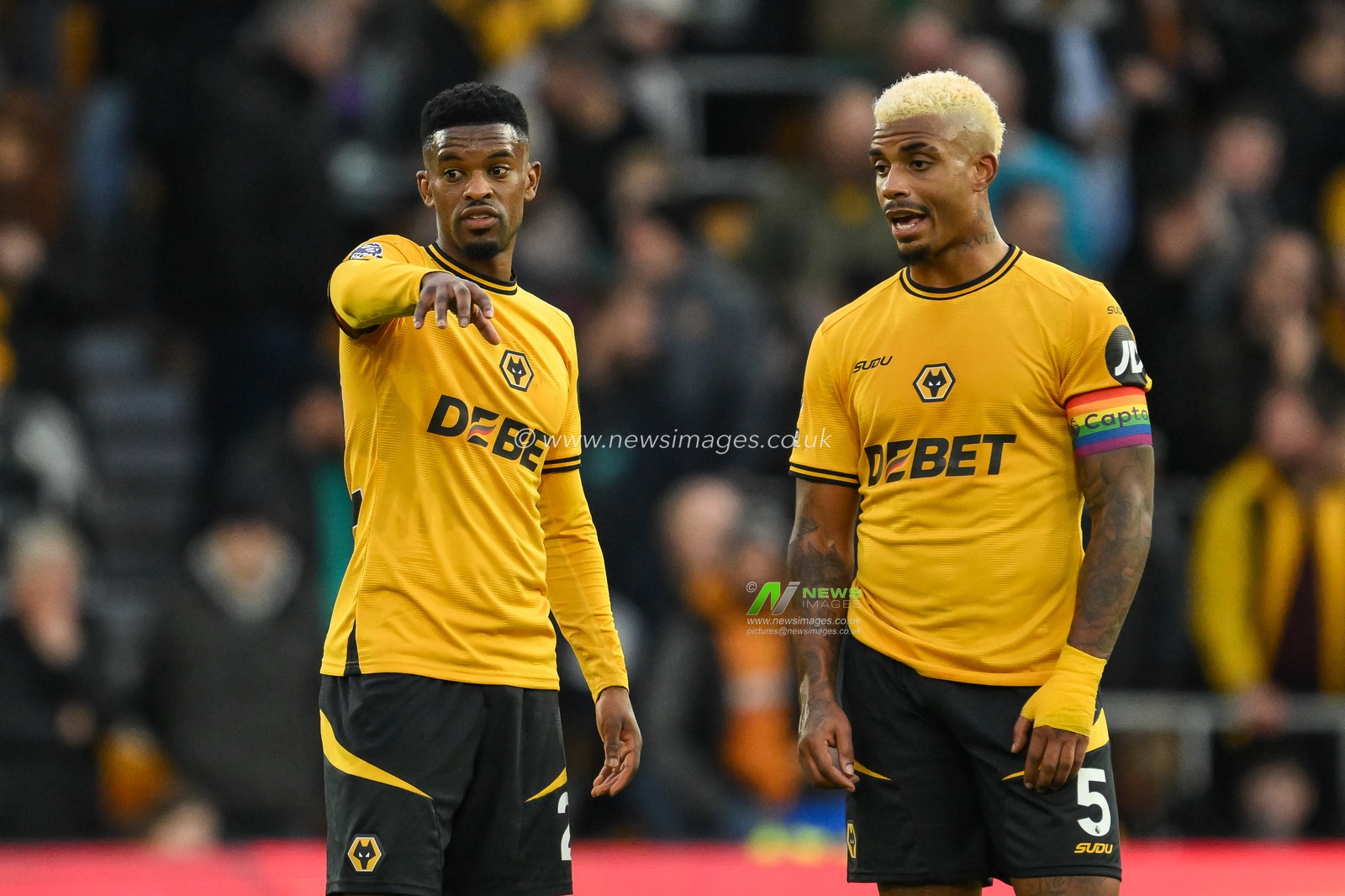 NÃ©lson Semedo of Wolverhampton Wanderers and Mario Lemina of Wolverhampton Wanderers speak during a break in play during the Premier League match Wolverhampton Wanderers vs Bournemouth at Molineux, Wolverhampton, United Kingdom, 30th November 2024

(Photo by Craig Thomas/News Images)