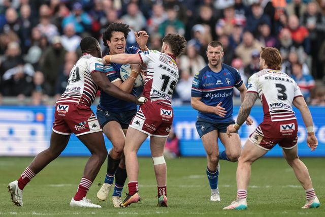 Isaiah Vagana of Wakefield Trinity is tackled by Jack Farrimond of Wigan Warriors and Sam Eseh of Wigan Warriors during the Betfred Challenge Cup Quarter Final match Wakefield Trinity vs Wigan Warriors at DIY Kitchens Stadium, Wakefield, United Kingdom on 12 April 2026

(Photo by Mark Cosgrove/News Images)