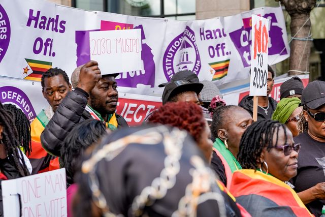 A man holds a placard written 2030 as Zimbabweans protest against the proposed constitution amendment at Embassy of Zimbabwe, London, United Kingdom on 18 April 2026

(Photo by Maynard Manyowa/News Images)