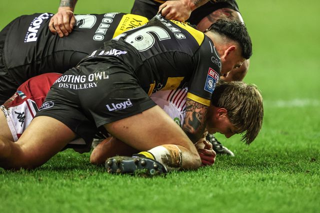 Sam Walters of Wigan Warriors is tackled by Ata Hingano of York Knights and Nikau Williams of York Knights during the Betfred Super League round 5 match Wigan Warriors vs York Knights at The Brick Community Stadium, Wigan, United Kingdom on 19 March 2026

(Photo by Alfie Cosgrove/News Images)