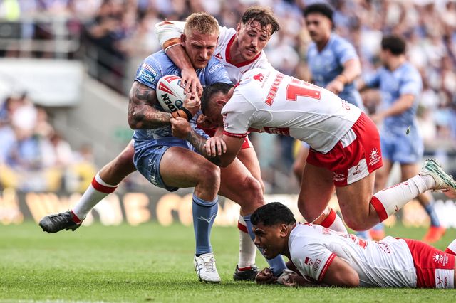 Mikołaj Olędzki of Leeds Rhinos is tackled by Elliot Minchella of Hull KR and Jai Whitbread of Hull KR during the Betfred Super League round 16 match Leeds Rhinos vs Hull KR at AMT Headingley Stadium, Leeds, United Kingdom on 26 June 2026

(Photo by Alfie Cosgrove/News Images)