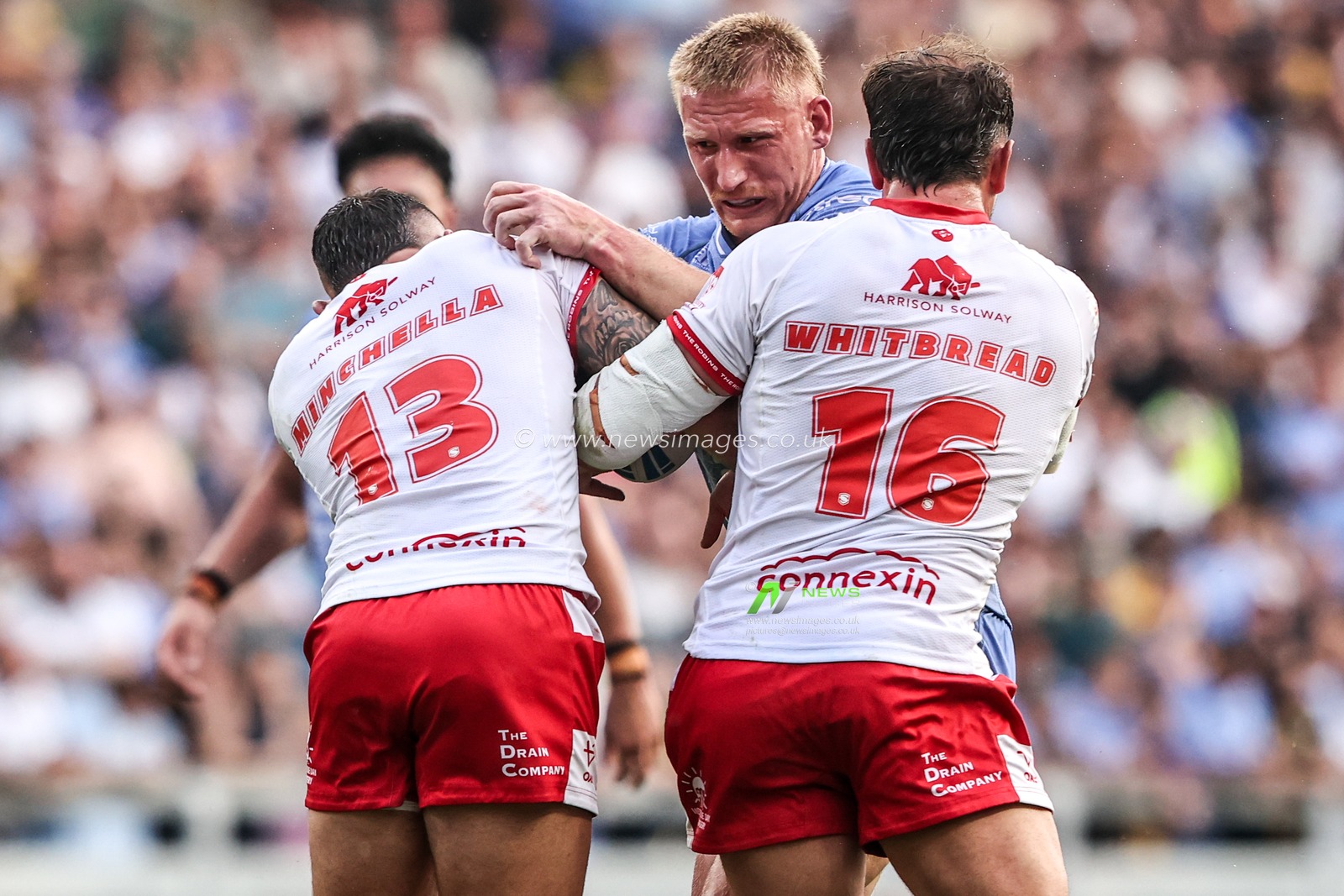 Mikołaj Olędzki of Leeds Rhinos is tackled by Elliot Minchella of Hull KR and Jai Whitbread of Hull KR during the Betfred Super League round 16 match Leeds Rhinos vs Hull KR at AMT Headingley Stadium, Leeds, United Kingdom on 26 June 2026

(Photo by Alfie Cosgrove/News Images)