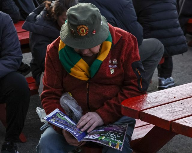 A Manchester United reads the match day program during the Premier League match Manchester United vs Leeds United at Old Trafford, Manchester, United Kingdom on 13 April 2026

(Photo by Mark Cosgrove/News Images)