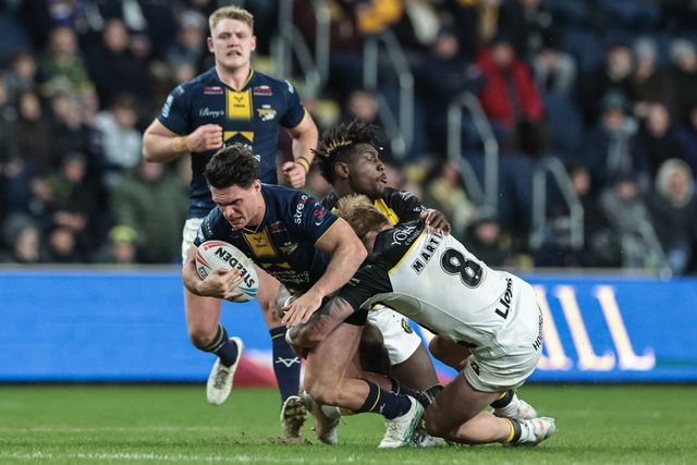 Brodie Croft of Leeds Rhinos is tackled by Justin Sangare and Jack Martin of York Knights during the Betfred Super League Round 2 match Leeds Rhinos vs York Knights at AMT Headingley Stadium, Leeds, United Kingdom on 20 February 2026

(Photo by Mark Cosgrove/News Images)
